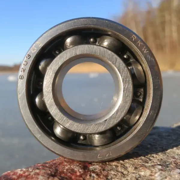 Used 6203 C3 deep groove ball bearing with its part number stamped on the outer ring
